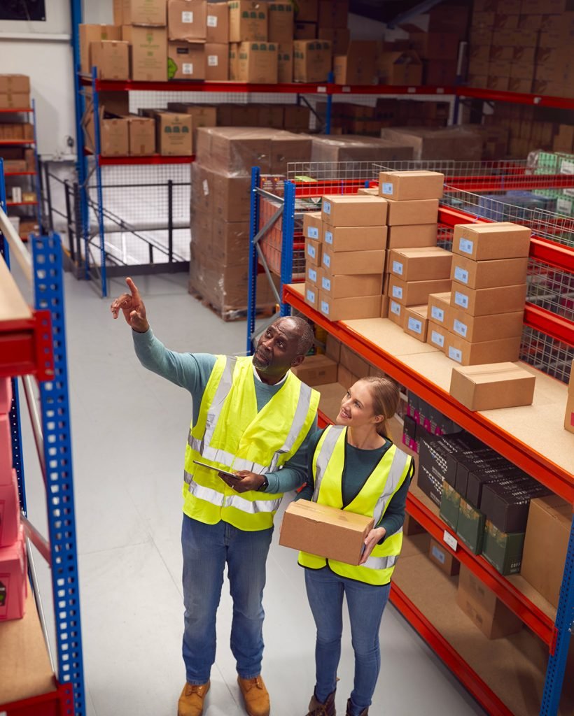 male-team-leader-with-digital-tablet-in-warehouse-2024-10-19-04-20-47-utc